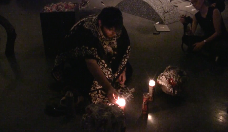 Performance by artist River Huerta Flores, in response to artist Alicia Lemus' work, "Una Mas", wherein River carried two plaster objects made by Alicia which donned images of women murdered along the US/Mexico border, inscribed with the words "femicide" and "not one more" across Worth Ryder Gallery. As they carried these objects repeatedly across the gallery, fellow artist AJ Perry beat a drum, and a looping and layered clip of the artist's mother and sister praying the catholic Hail Mary prayer played.