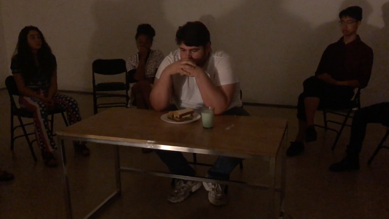 Performance where the artist, River Huerta Flores, ate a sandwich and drank a cup of milk. The performance relates the mundane action of eating, in a seemingly solitary condition while being surrounded by people as an attempt to humanize the figure of the alcoholic and addict, while narrating what they call new age alcoholic folklore.